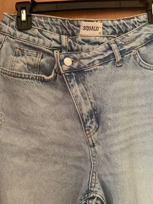 Jeans with asymmetrical buttoning like new, size M, blue