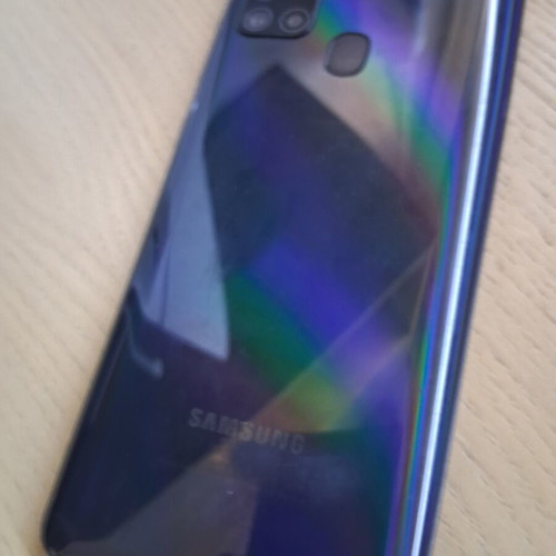 Samsung Galaxy A21s smartphone with accessories