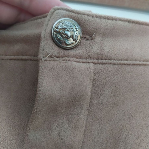 Skirt used with suede-type fringes and matte antique gold details