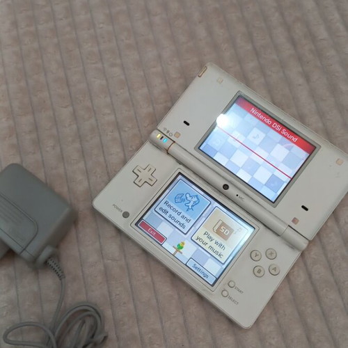 Nintendo DS used with original charger, no stylus