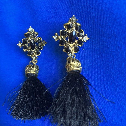 Gold and black earrings with tassel