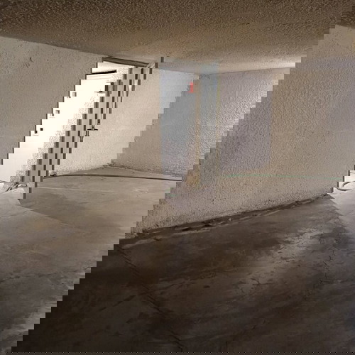 Underground parking space with car elevator, Athens Three Bridges