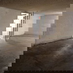 Underground parking space with car elevator, Athens Three Bridges