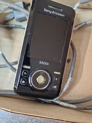Sony Ericsson S500i used retro mobile phone with cable