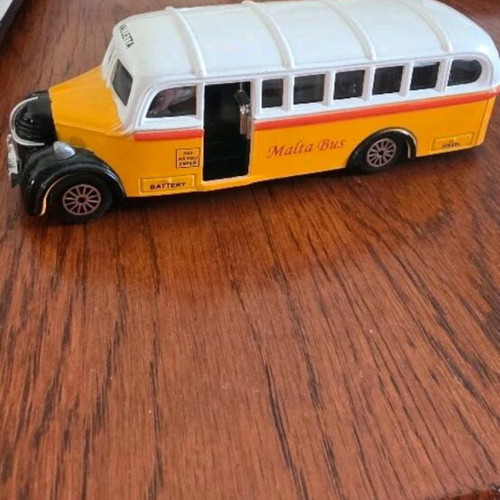 Collectible toy cars used, London Taxi and Valletta bus