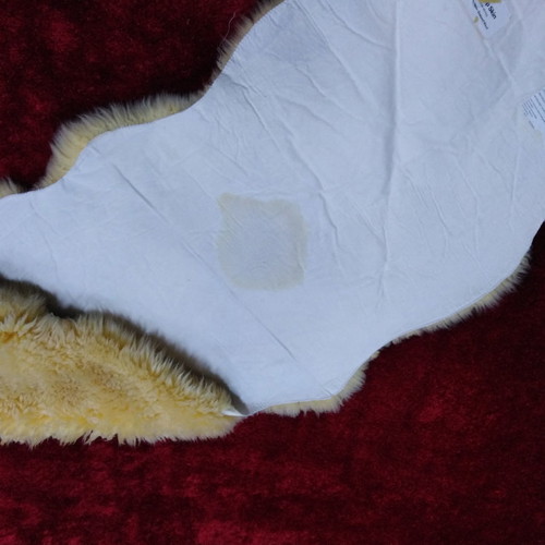 Sheepskin rug new, champagne color 2.05x0.75