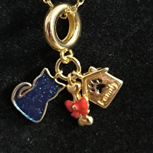 Gold Tone Necklace with Cat, House, and Red Bow Charms