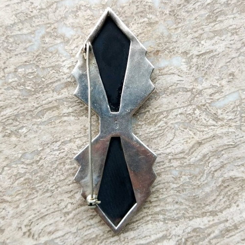 Silver brooch like new, 8 cm length, 22 grams, black and silver