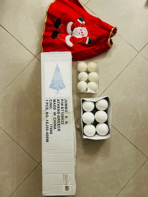 White Christmas tree used with 12 white balls and red skirt