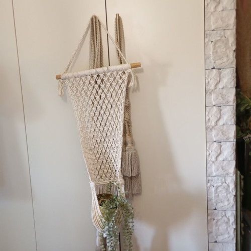 Two knitted wall hangers for pots, different sizes