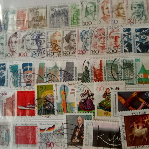 Stamp album with some stamps, mostly cancelled