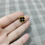 Gold earrings with black classic design, like new, steel