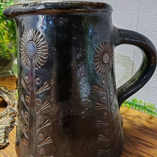 Retro ceramic milk jug with embossed flowers