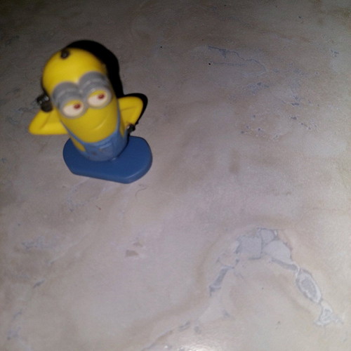 Minion figure with rotating base like new