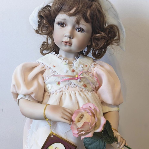 Alberon Casey porcelain doll with wooden stand, 50cm