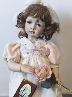 Alberon Casey porcelain doll with wooden stand, 50cm