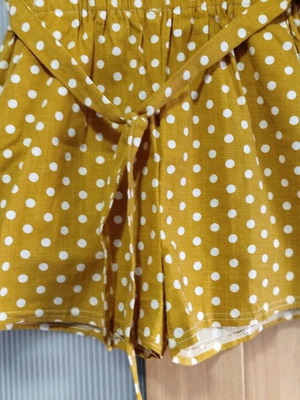Mustard shorts Acne Studios used with white polka dots and belt