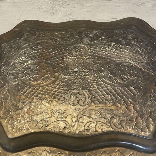 Vintage metal serving tray used with embossed floral and geometric carvings
