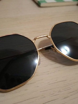 Sunglasses new in black with gold frame