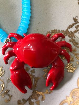 Necklace with blue glass and red crab charm like new