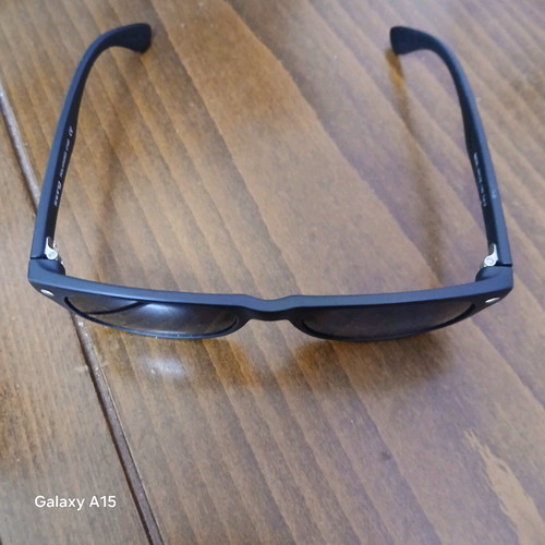 Swing sunglasses new with black plastic frame and men's lenses