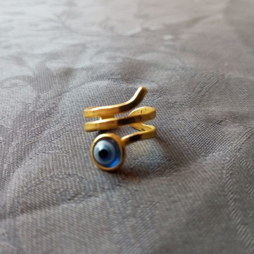 Adjustable ring with eye, gold color, like new