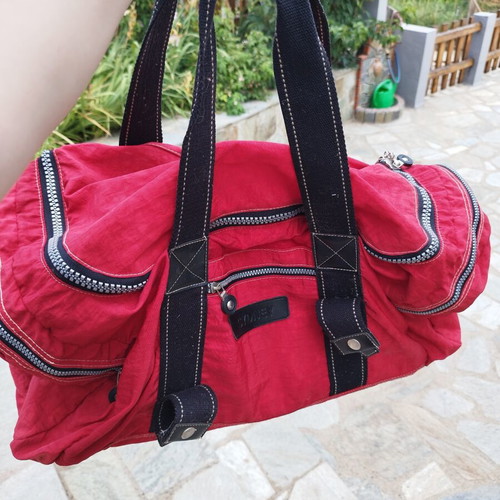 Travel sack with multiple compartments, red
