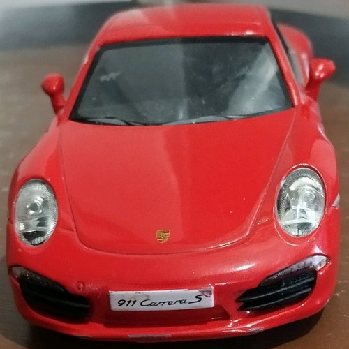 Collectible Porsche Carrera toy car with opening doors like new