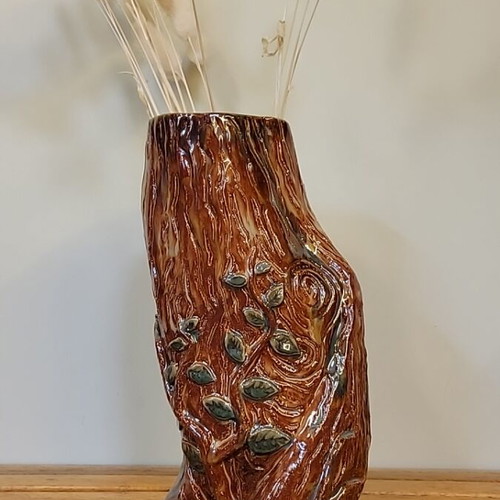 Handmade ceramic vase with natural decorative elements