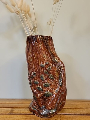 Handmade ceramic vase with natural decorative elements