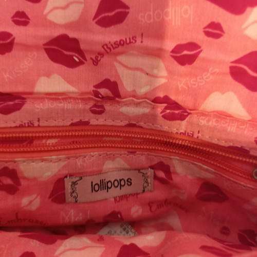 Lollipops bag silver color with decorative wings, like new