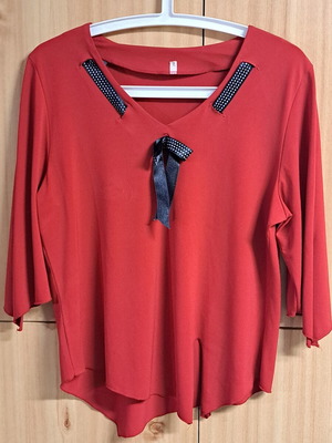 Women's elegant red blouse with black and white ribbon