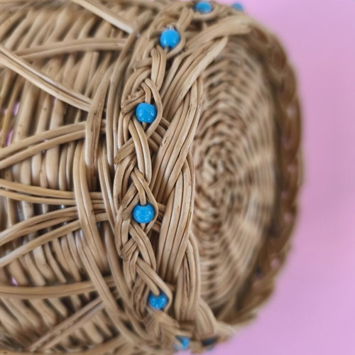 Handmade woven basket used with handle and decorative beads