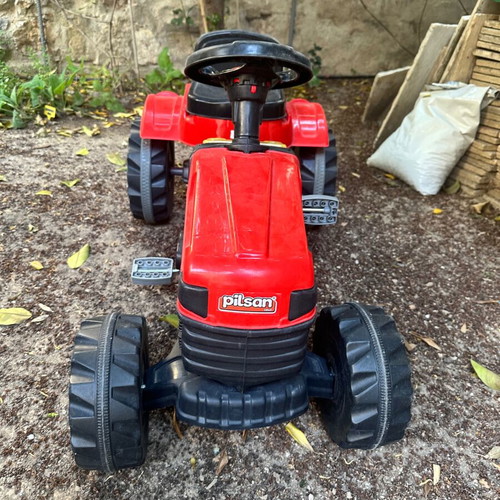 Small red pedal tractor for kids like new