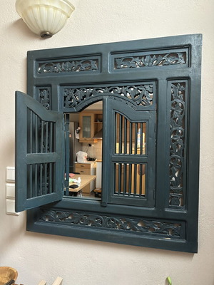 Handmade wooden carved window with floral motifs, traditional decorative art