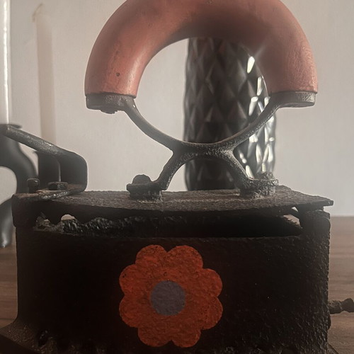 Cast iron charcoal iron used with painted flowers