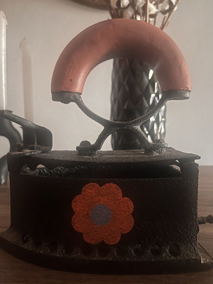 Cast iron charcoal iron used with painted flowers