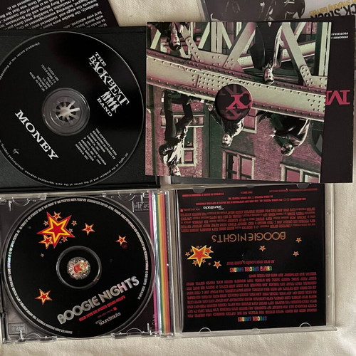CDs with Boogie Nights, Lock Stock, Reality Bites movie soundtracks like new