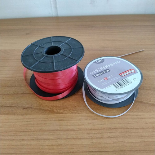 Gift wrapping ribbons used, red and salmon set