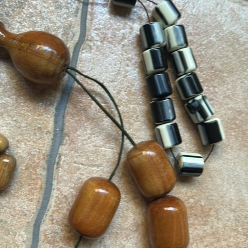 Decorative komboloi set like new, two wooden brown and one black and white
