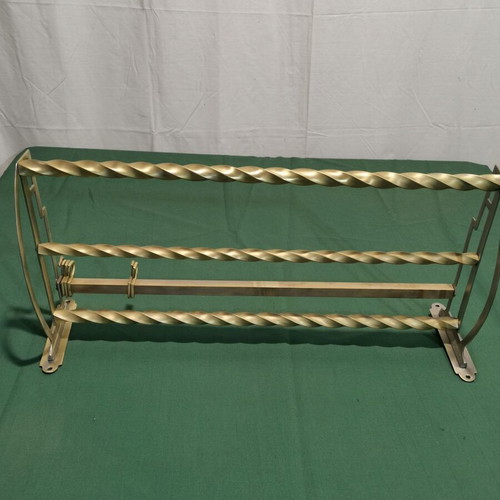 Brass wall-mounted hanger used