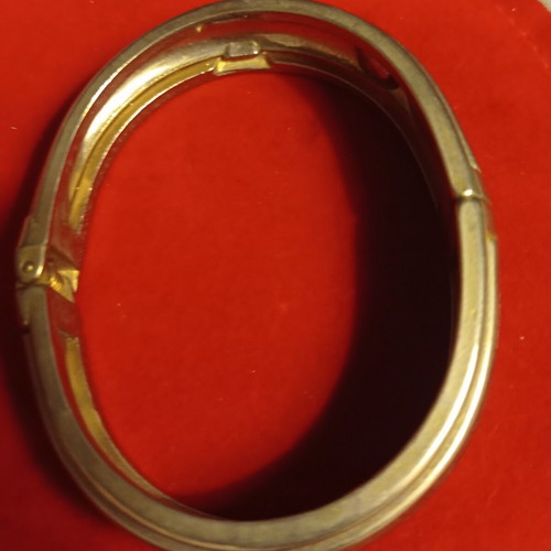 Vintage hinged bangle bracelet like new, gold and silver tone
