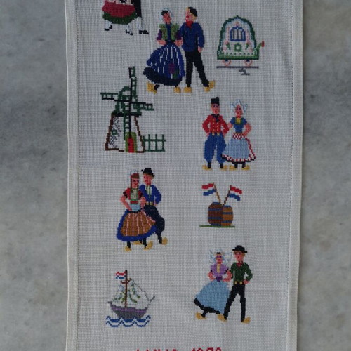 Embroidery with traditional costumes and Dutch scenes like new