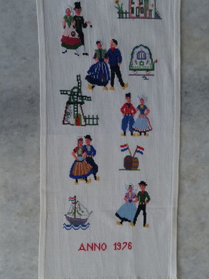 Embroidery with traditional costumes and Dutch scenes like new
