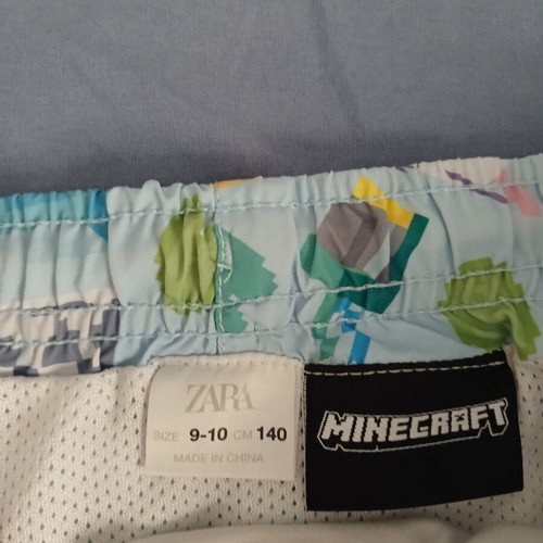 Minecraft swim shorts and Spiderman hooded towel, Zara