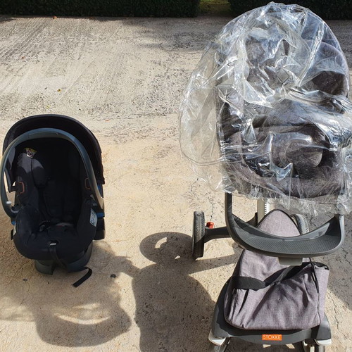 Stokke Xplory stroller used with port bebe, footmuff, bag, umbrella, mosquito net, rain cover