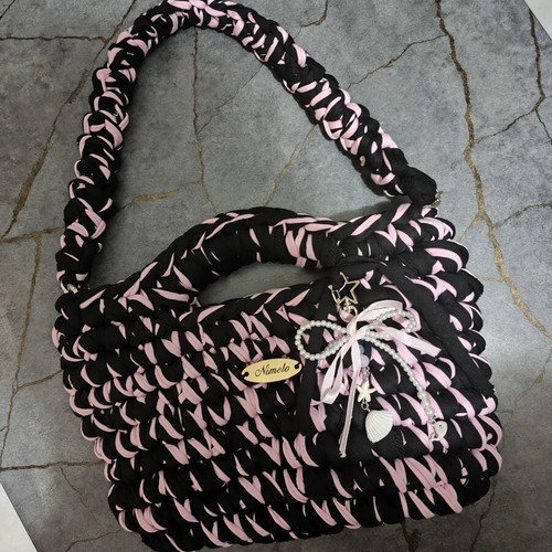 Knitted shoulder bag with lining and button handmade, black and pink