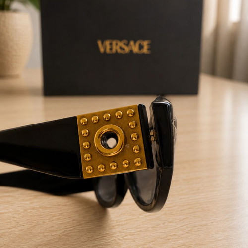 Versace collectible sunglasses, black lenses and frame
