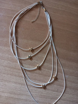Star Necklace with Beige Cord and Multiple Layers Like New