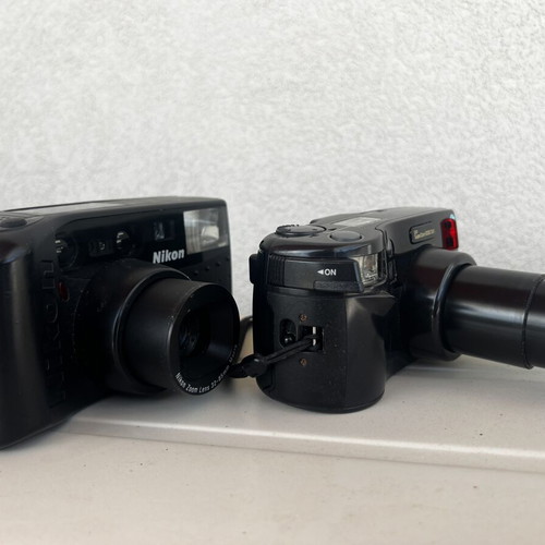 Olympus Super Zoom and Nikon Zoom Touch 600 cameras used